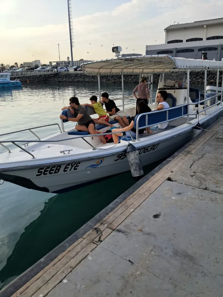 Tour boat with guests on board moored at Seeb Marina in Muscat, the departure point for Daymaniyat Islands trips